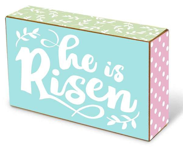 decorator blox with an uplifting message. A perfect addition to your Easter decor! Features the inspirational message: He is Risen. Measures 3.75" x 6.25" x 1.75". Material: Wood.